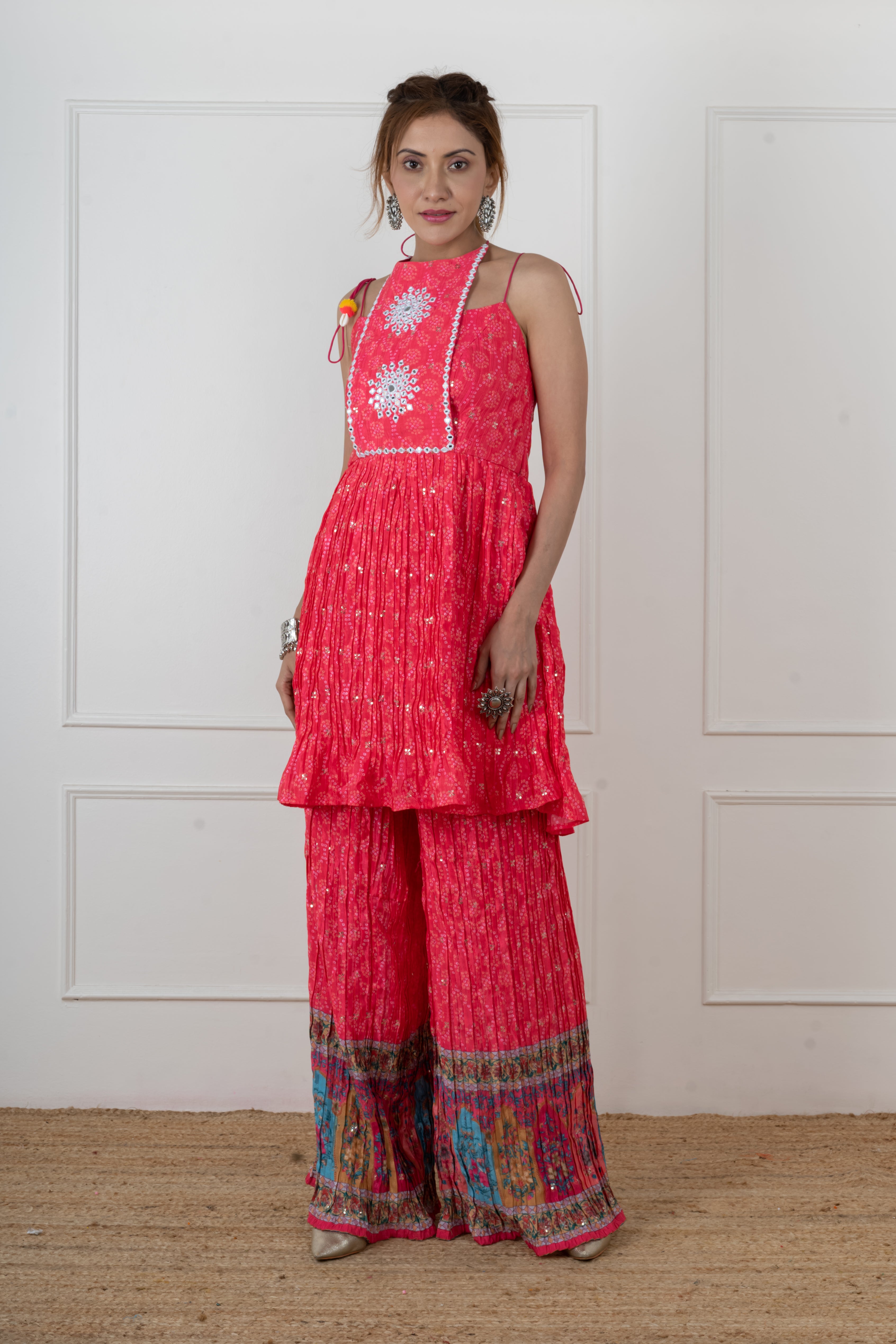 mirror work embroidery on pink Bandhani sleeveless kurta